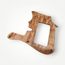 Exotic wood pickguard and cavity cover set.