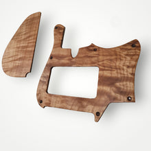 Exotic wood pickguard and cavity cover set.