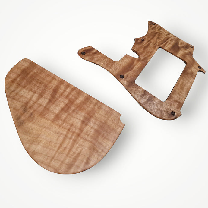 Exotic wood pickguard and cavity cover set.